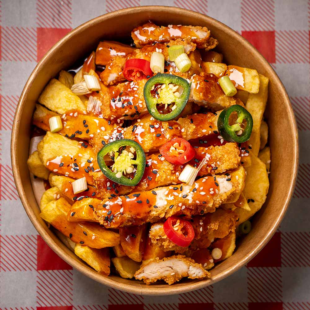 Crispy chicken with chilli and chips on a red gingham tablecloth